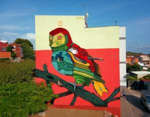 Graffiti comercial en León - Mural fachada entera Fetival Art, Búho
