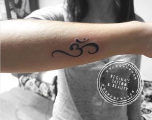 Tatuajes en el brazo - Om Tattoo